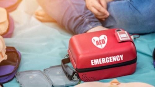 Automated External Defibrillator (AED) Emergency Kit on the ground.